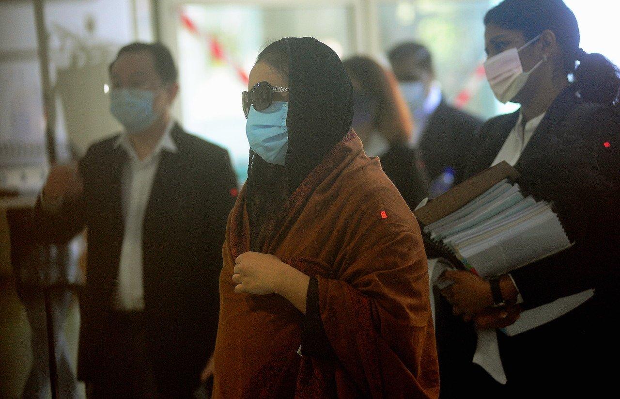 Samirah Muzaffar, the widow of Cradle Fund CEO Nazrin Hassan, arrives at the High Court in Shah Alam today where her trial for his murder is ongoing. Photo: Bernama