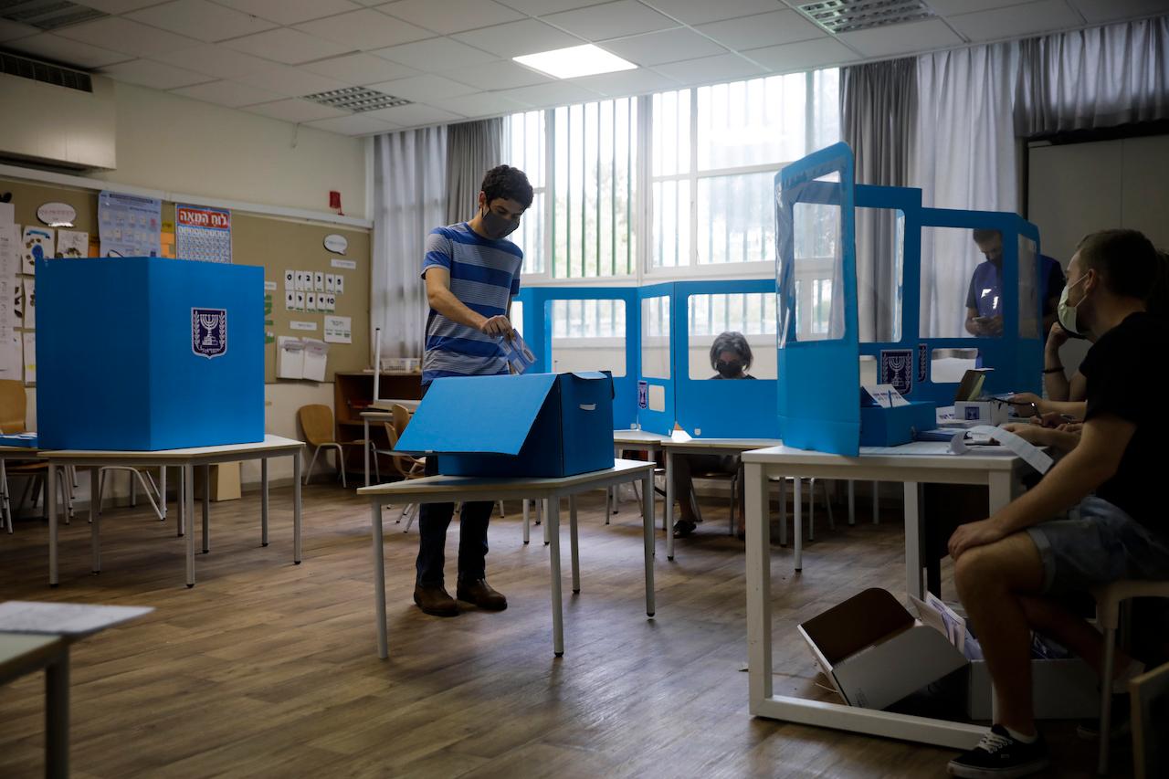 A man casts his vote at a polling station in Tel Aviv, Israel, March 23. Israel is holding its fourth election in less than two years. Photo: AP