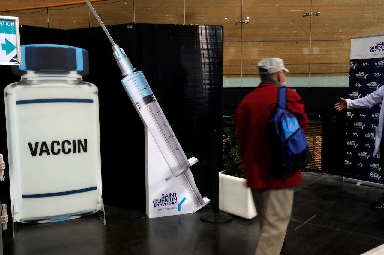 A man leaves after receiving Pfizer's Covid-19 vaccine at the Saint Quentin en Yvelines velodrome, used as a Covid-19 vaccination site, outside Paris, March 24. EU leaders are still struggling to speed up vaccinations, trailing countries like Britain and the US and facing supply delays. Photo: AP