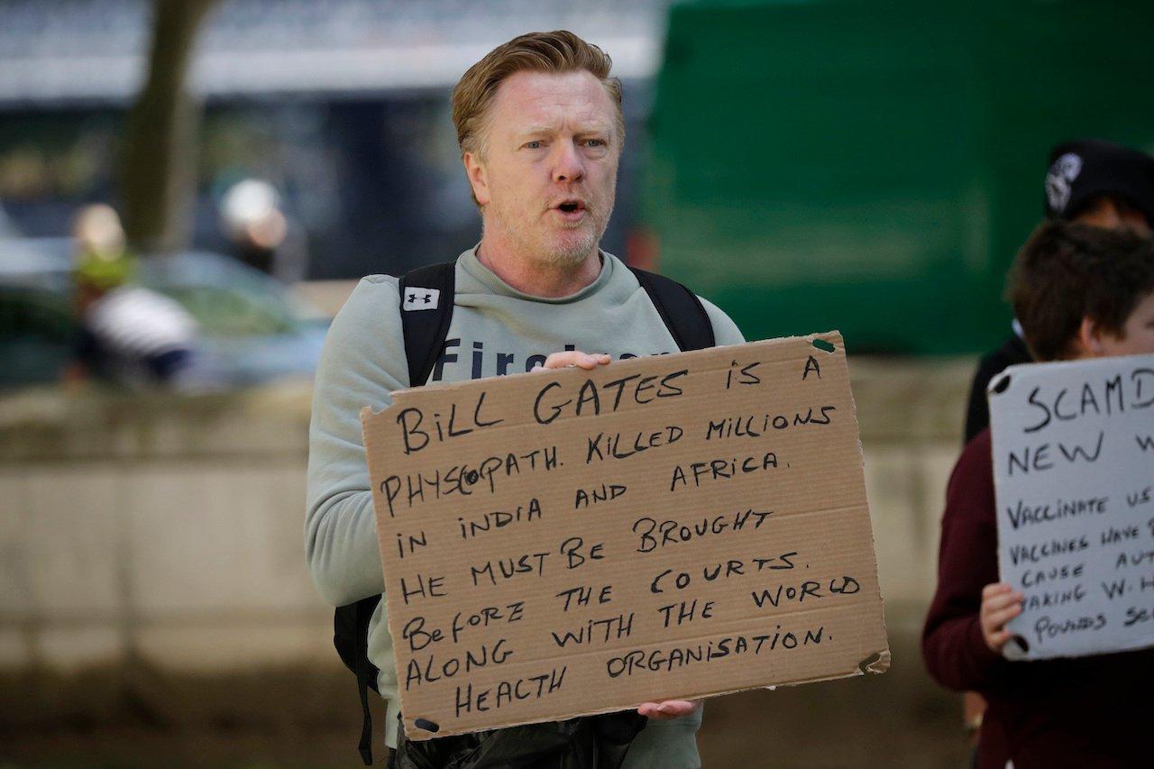 A man holds up an anti-Bill Gates placard at a coronavirus anti-lockdown, anti-vaccine, anti-5G and pro-freedom protest near Scotland Yard, the headquarters of London's Metropolitan Police Service, in London, May 2, 2020. Gates’ foundation has donated US$1.75 billion to support vaccines and possible treatments to combat the worldwide pandemic although he remains the subject of wild conspirary theories. Photo: AP