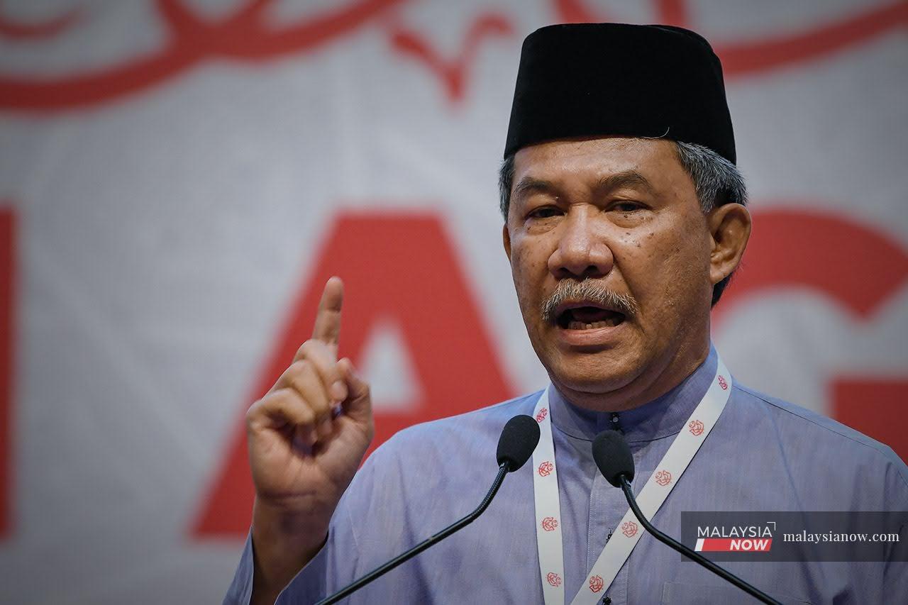 Umno deputy president Mohamad Hasan officiates the party's general assembly in Kuala Lumpur today.