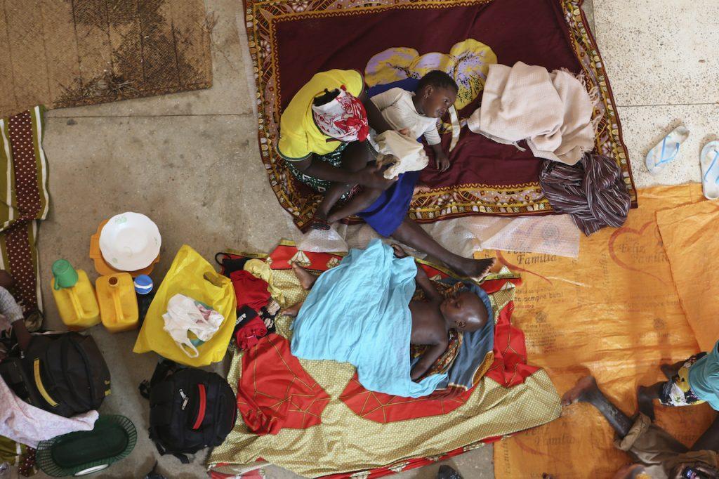 In this file photo dated April, 29, 2019, a mother and her children prepare for the night inside a Roman Catholic Church in Pemba city on the northeastern coast of Mozambique. Northern Mozambique’s humanitarian crisis is quickly growing, with more than 650,000 people displaced by the Islamic extremist insurgency in the Cabo Delgado province. Photo: AP