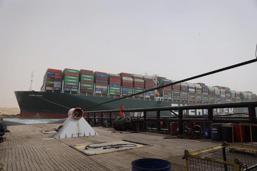 According to MarineTraffic, about 100 ships laden with oil or refined products were in holding areas Sunday as the giant container ship MV Ever Given remained wedged across the Suez Canal. Photo: AP