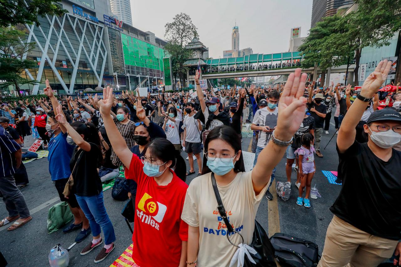 Pro-democracy activists flash a three-fingered symbol of resistance during a rally in Bangkok, Thailand, March 24. Photo: AP