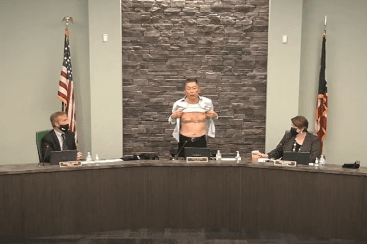 A screenshot of Lee Wong showing his scars at a town hall meeting in the US. Thousands of Asian-Americans have reported violent attacks or hate crimes in recent months, often linked to language that blames Asians for the spread of Covid-19.