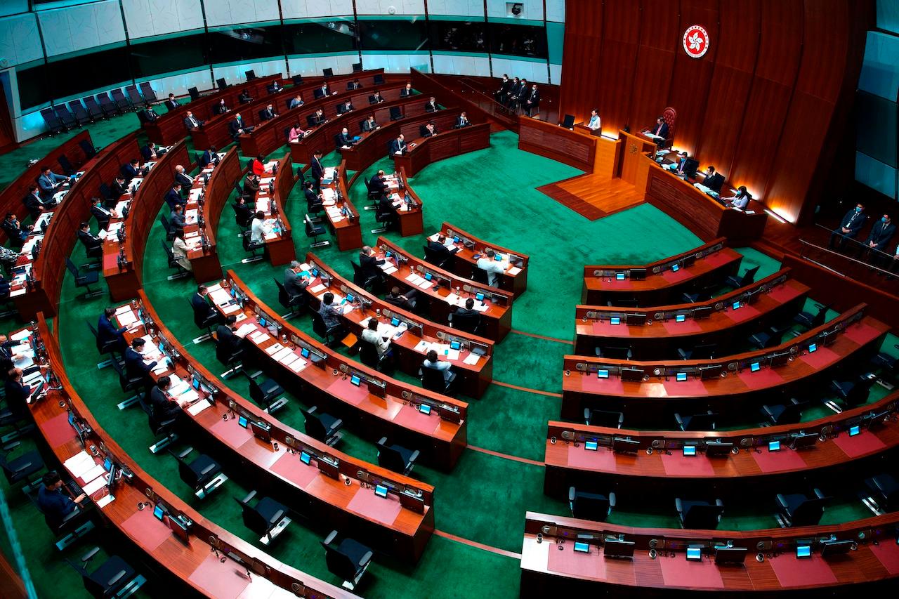 Hong Kong Chief Executive Carrie Lam listens to questions during a question and answer session at the Legislative Council in Hong Kong, March 17. China's top legislature approved amendments to Hong Kong's constitution on March 30, that will give Beijing more control over the make-up of the city's legislature. Photo: AP