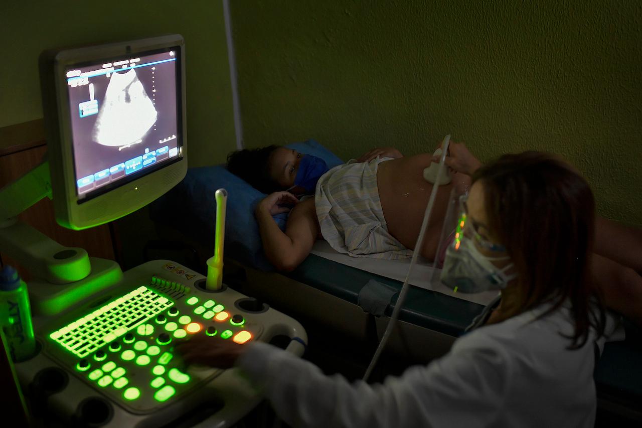 A woman in Caracas, Venezuela, has an ultrasound at a clinic, Sept 7, 2020. An international data review has found an overall increase in the risks of stillbirth and maternal death during the pandemic, with a disproportionately greater impact on poorer countries. Photo: AP