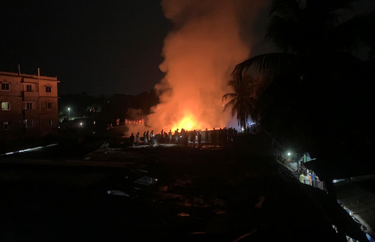 Flames rise from a fire in a makeshift market at a Rohingya refugee camp in Kutupalong, Bangladesh, April 2. The fire broke out early Friday when residents of the sprawling Kutupalong camp for Myanmar's Rohingya refugees were asleep. Photo: AP