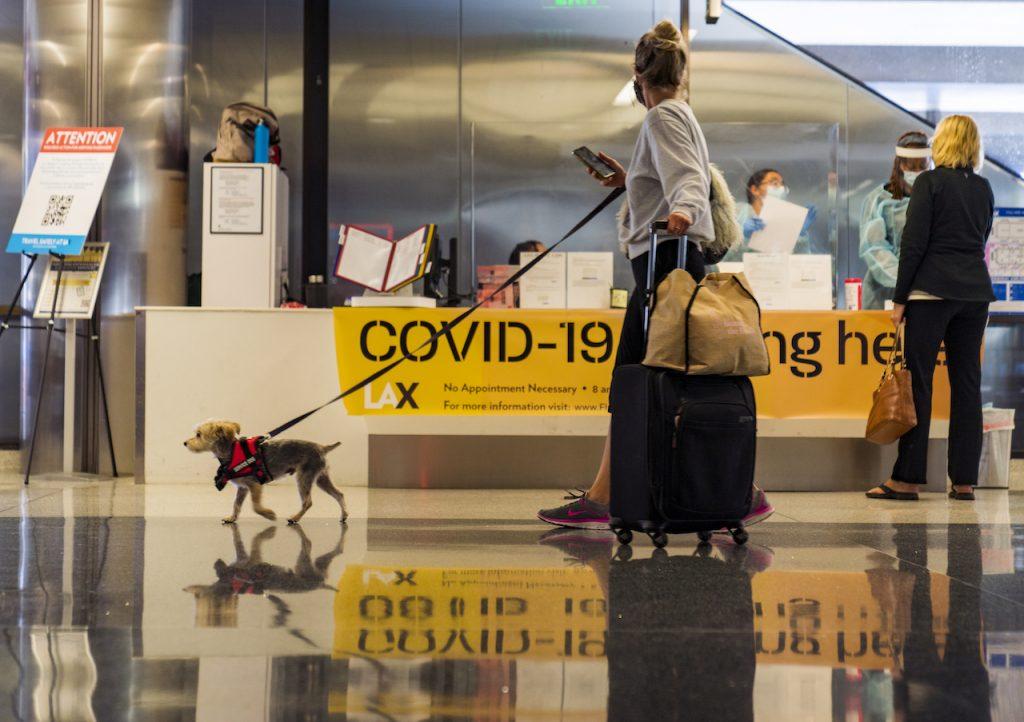 Travellers inquire about Covid-19 tests at the Los Angeles International Airport in Los Angeles, Nov 25, 2020. Vaccinated travellers can now go abroad without getting a Covid-19 test before travel unless it is required by the international destination, US health authorities say. Photo: AP