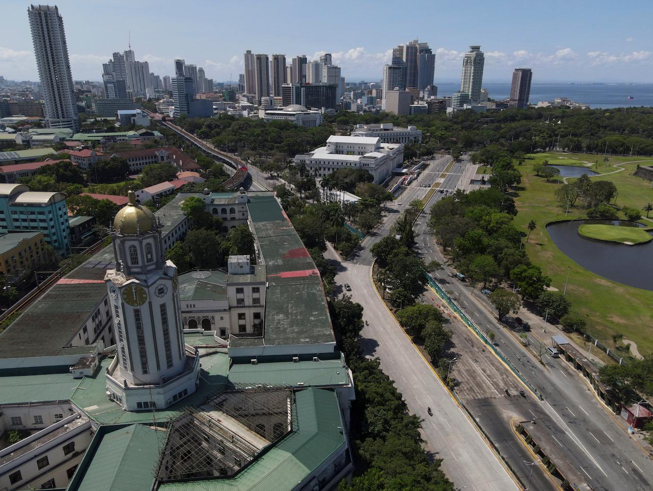 The Manila City Hall stands beside an almost empty road as the government moved to implement a strict lockdown to prevent the spread of the coronavirus in Quezon city, Philippines, April 2. Photo: AP