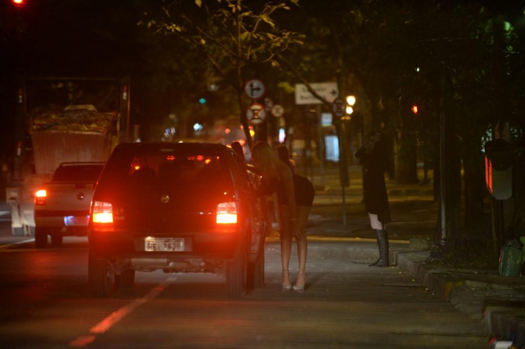 Prostitutes wait for clients in the streets of Belo Horizonte, Minas Gerais state in Brazil, on April 25, 2013. Thousands of sex workers in the city have been forced by pandemic-related closure of hotels to solicit for clients on the street, they say. Photo: AFP