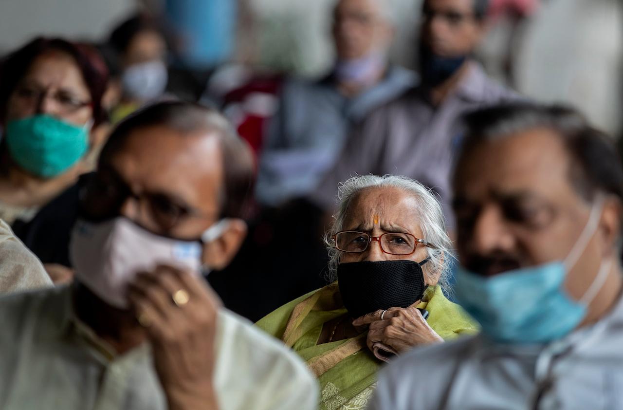 Elderly Indians wait to receive the Covid-19 vaccine at a private hospital in Gauhati, India, March 4. India has now recorded 12.8 million cases, the third-highest behind the US and Brazil. Photo: AP