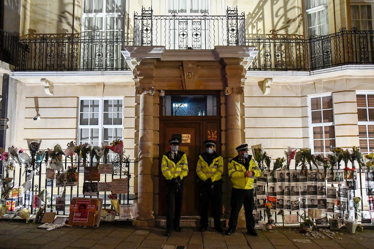 Police officers patrol outside the Myanmar embassy in London, April 7. Reports say the embassy was taken over by members of the country's new military regime Wednesday evening. Photo: AP