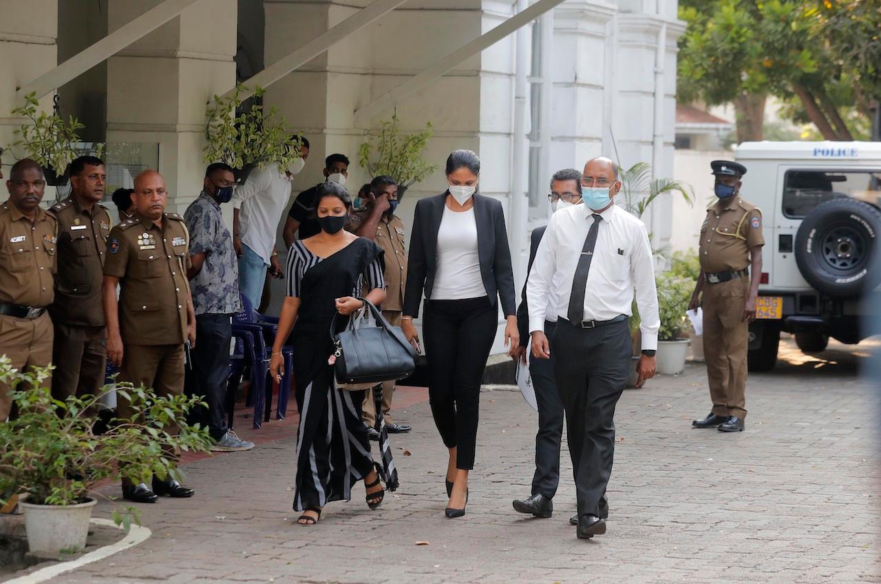 Mrs World 2019 Caroline Jurie (centre) leaves a police station after obtaining bail in Colombo, Sri Lanka, April 8. Jurie's decision to remove the crown from the the winning Mrs. Sri Lanka contestant on stage moments after the winner was announced, because of claims she was a divorcee, drew widespread social media condemnation. Photo: AP