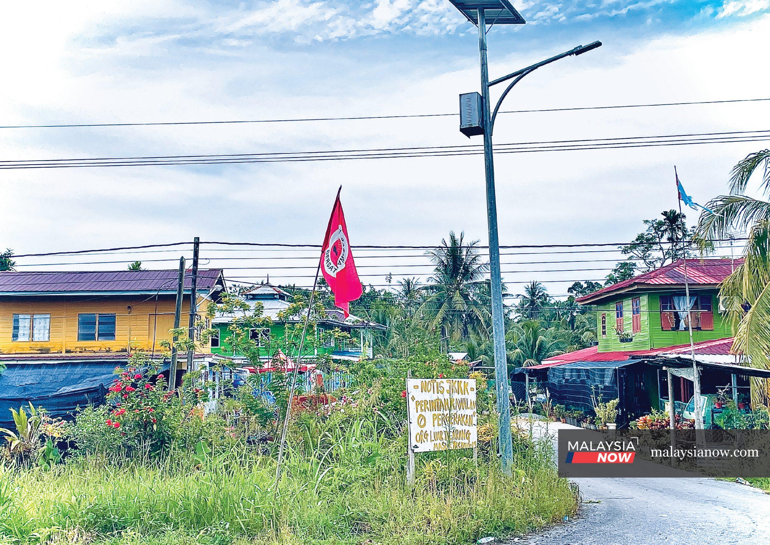 A Parti Sarawak Bersatu flag flutters in the town of Asajaya in Samarahan, Sarawak. Most of the seats in the state are held by GPS, which says it intends to contest all 82 state seats in the upcoming Sarawak election.