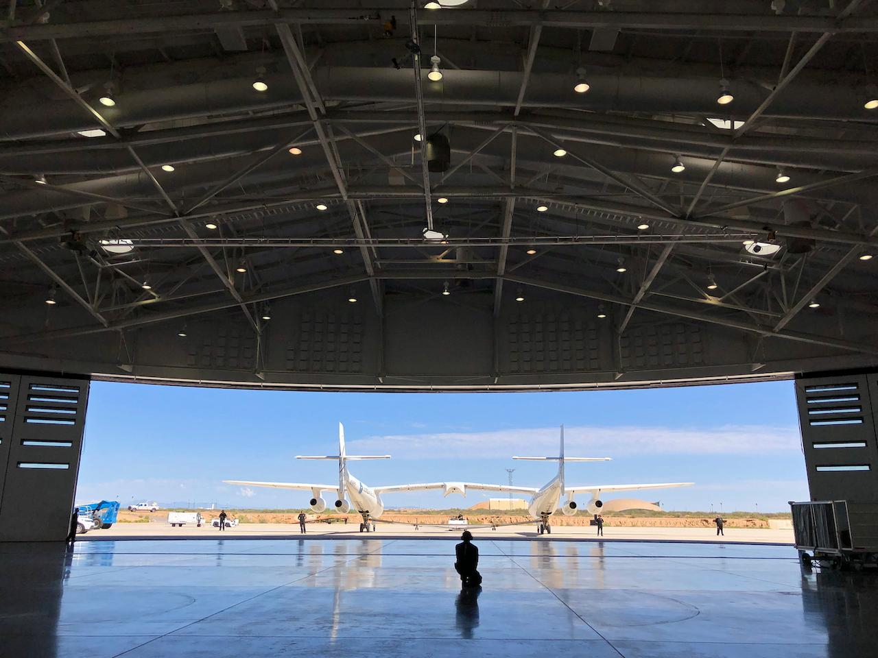 Virgin Galactic ground crew guide a carrier plane into the hangar at Spaceport America following a test flight over the desert near Upham, New Mexico, Aug 15, 2019. Virgin Galactic is one of two companies building spacecraft capable of sending private clients on suborbital flights to the edge of space lasting several minutes. Photo: AP