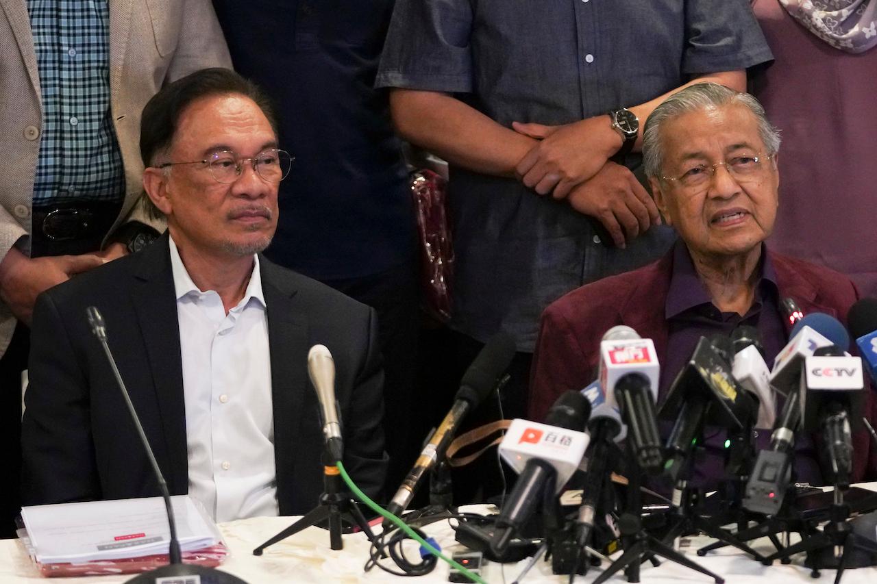 Dr Mahathir Mohamad (right) speaks at a press conference with Pakatan Harapan leaders including Anwar Ibrahim on Feb 22, 2020, just days before resigning as prime minister, a move which triggered the collapse of the PH government. Photo: AP