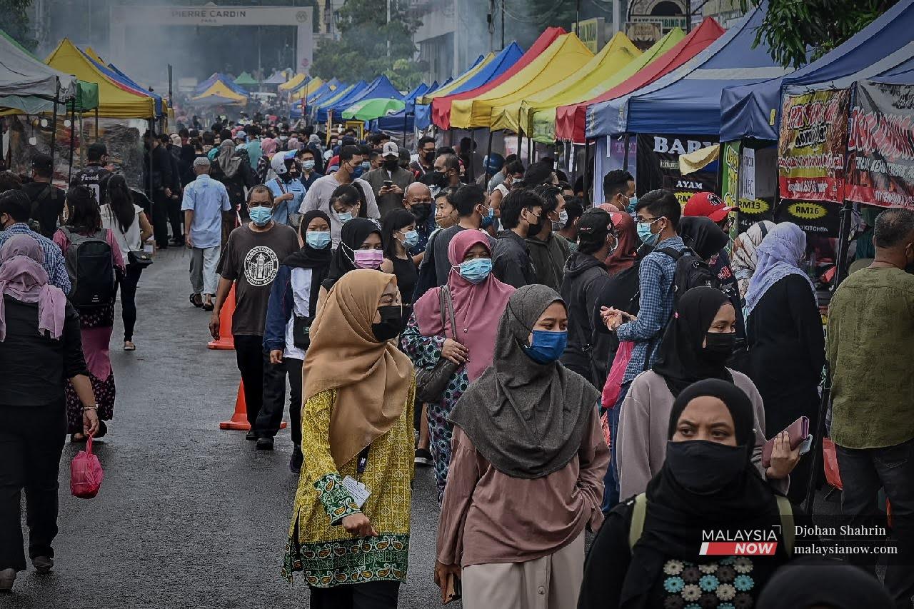 Crowds throng the Ramadan bazaar in Kampung Baru, Kuala Lumpur, ahead of the breaking of fast on April 16.