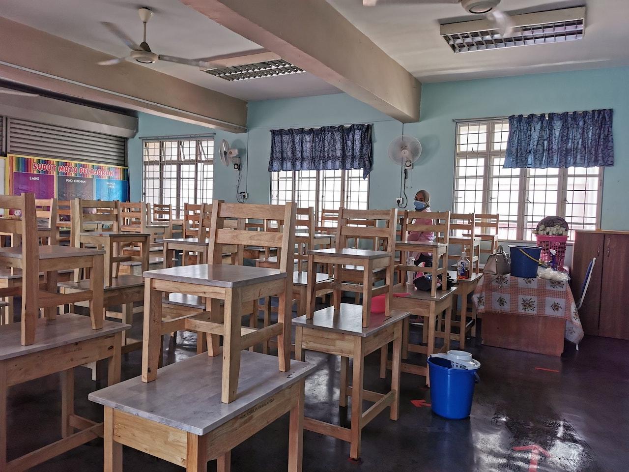 Classrooms at Sekolah Kebangsaan Bukit Jelutong in Shah Alam are cleaned earlier this year before the return of students in March. Photo: Facebook