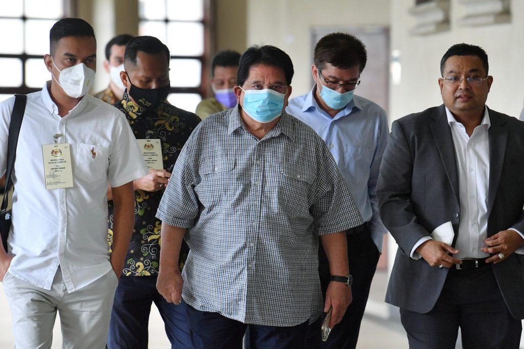 Former minister Tengku Adnan Tengku Mansor (centre) at the High Court in Kuala Lumpur where he was found guilty of receiving RM2 million from a businessman five years ago. Photo: Bernama