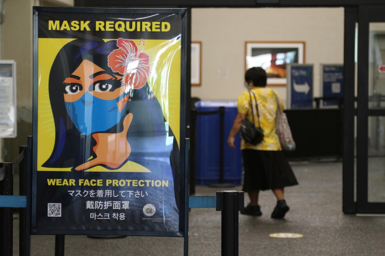A woman walks into the international airport in Honolulu on Oct 2, 2020. More governments are announcing that they will allow proof of vaccination as an alternative to existing testing and quarantine requirements. Photo: AP