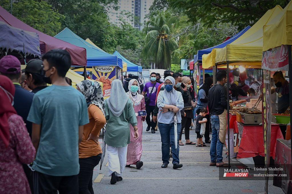Customers stroll through the Ramadan bazaar in Pandan Indah, Kuala Lumpur.