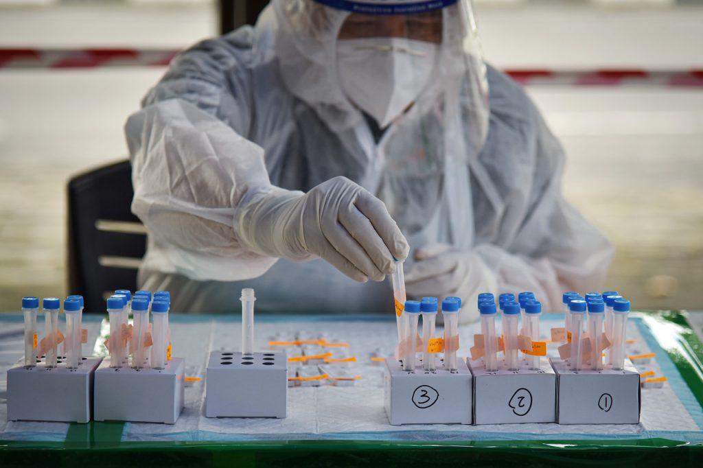 A health worker at Klinik Bakti in Labuan conducts an RTK Antigen test to check for Covid-19 in swab samples. Photo: Bernama