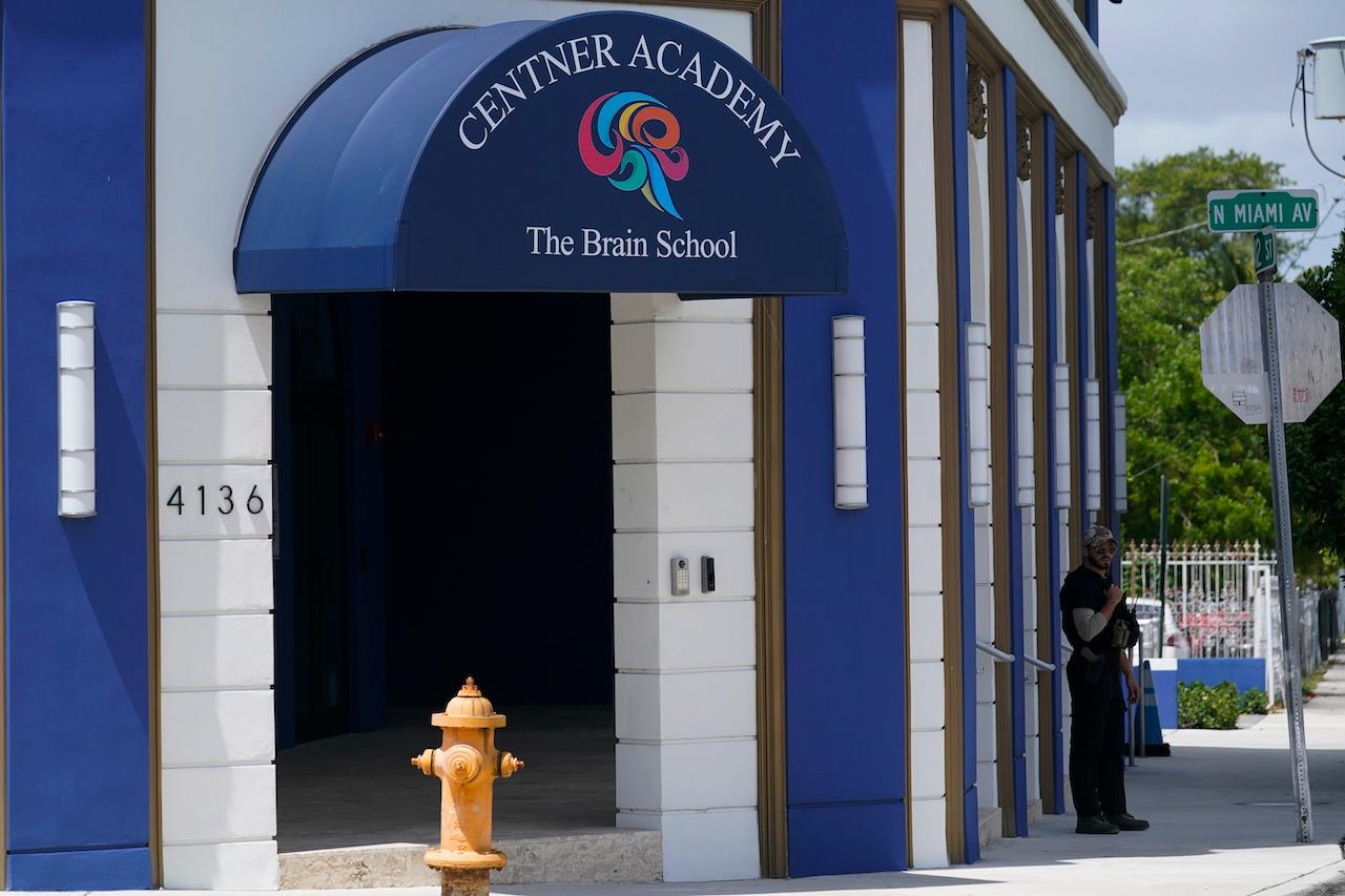 A security guard walks the perimeter of the Centner Academy in Miami, April 27. The private school founded by an anti-vaccination activist in South Florida has warned teachers and staff against taking the Covid-19 vaccine. Photo: AP