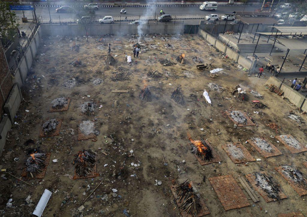 Multiple funeral pyres of Covid-19 victims burn in a plot of land that has been converted into a crematorium for mass cremation, in New Delhi, India, April 21. Photo: AP