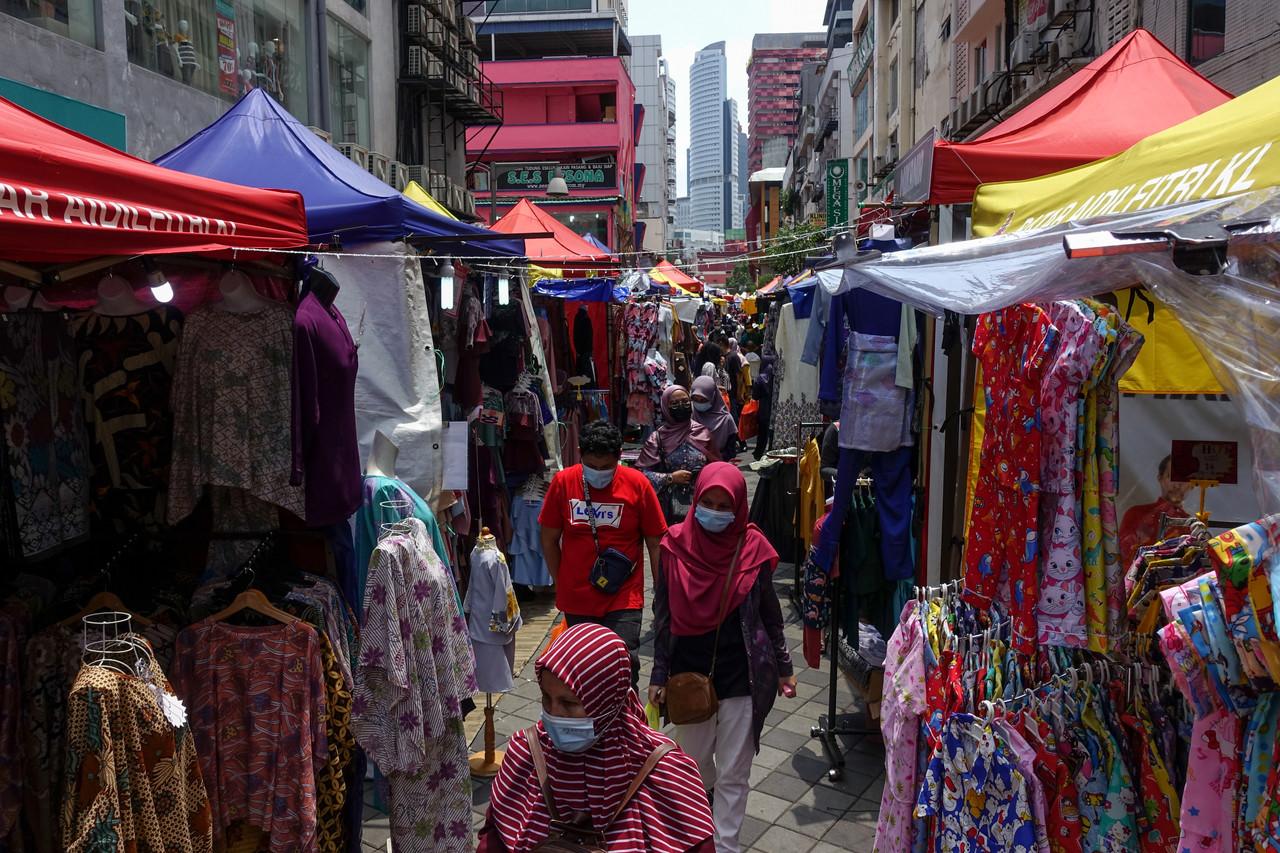 Customers stroll through the Aidilfitri bazaar at Lorong Tuanku Abdul Rahman in Kuala Lumpur today. Photo: Bernama