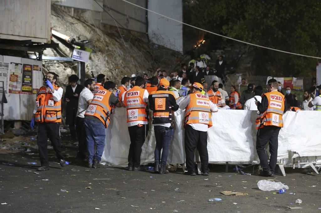 Emergency workers gather at the scene after dozens of people were killed and others injured after a grandstand collapsed in Meron, Israel, where tens of thousands of people were gathered to celebrate the festival of Lag BaOmer at the site in northern Israel early on April 30. Photo: AFP
