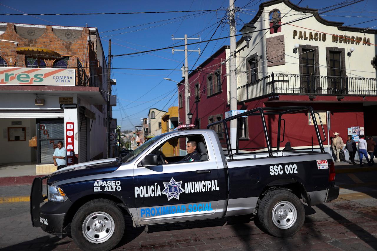 In this Feb 10, 2020 file photo, a policeman drives past town hall in Apaseo El Alto, Guanajuato state, Mexico. Photo: AP