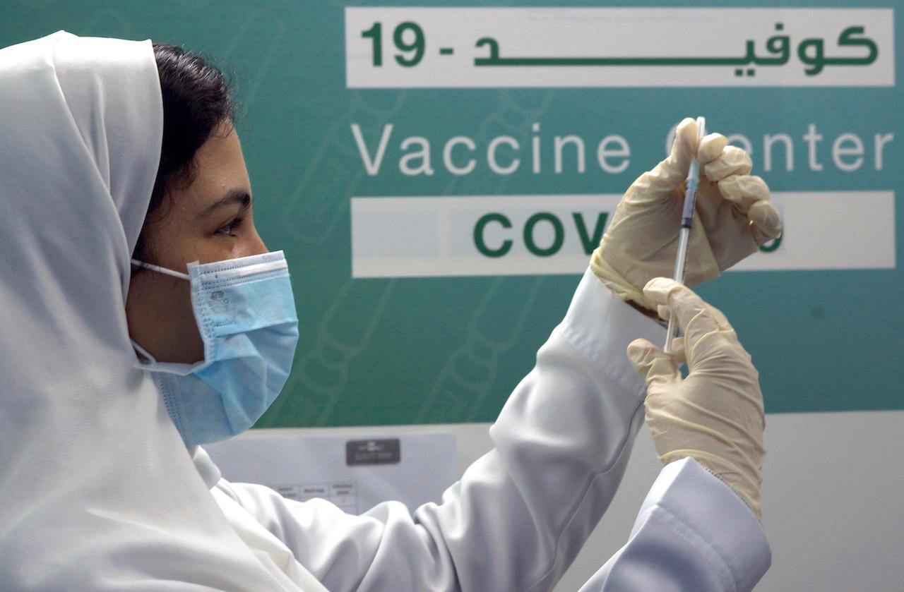 A Saudi physician prepares to administer a Pfizer vaccine at a Covid-19 vaccination centre, at the Jiddah old airport, Saudi Arabia, Jan 14. Photo: AP