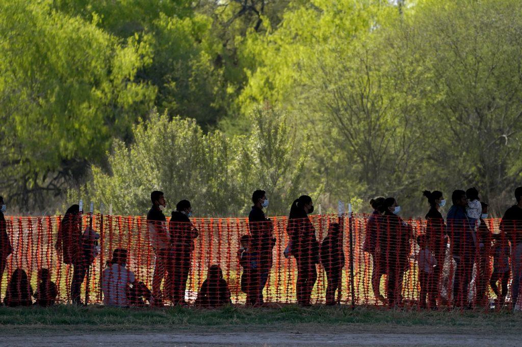 Migrants are seen in custody at a US Customs and Border Protection processing area under the Anzalduas International Bridge, in Mission, Texas, March 19. Record-breaking numbers of undocumented migrants have been crossing into the US from Mexico. Photo: AP