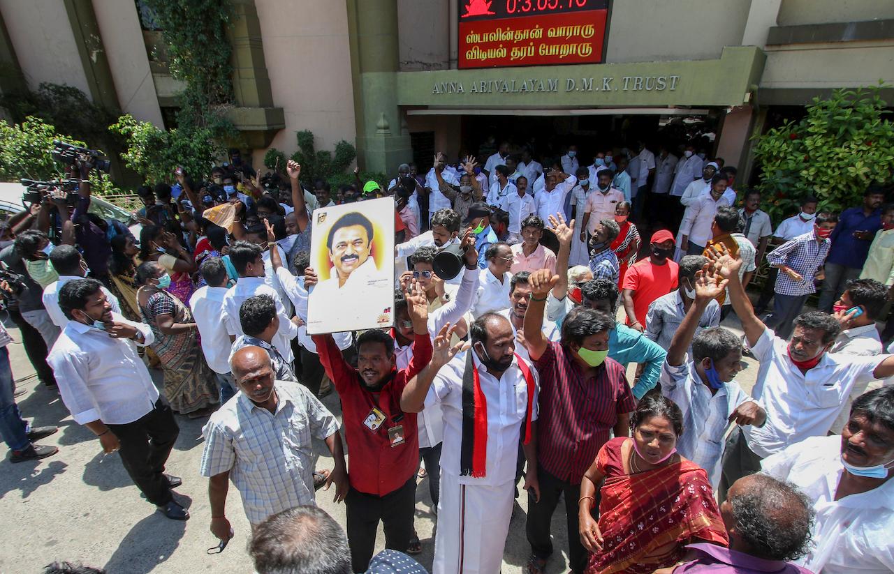 Dravida Munnetra Kazhagam party cadres display a photograph of their leader MK Stalin as they celebrate early leads for the party in the Tamil Nadu state assembly elections in Chennai, India, May 2. Photo: AP