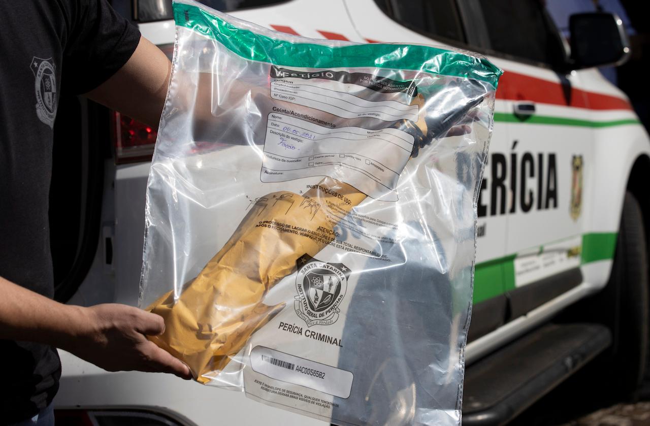 A police officer holds an evidence bag containing a weapon believed to have been used in an attack at the Aquarela preschool in Saudades, in the southern state of Santa Catarina, Brazil, May 4. Photo: AP