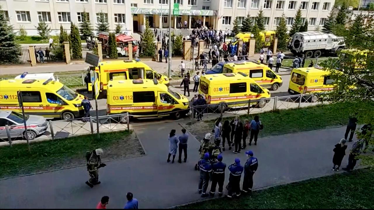 In this image taken from video, an ambulance and police trucks are parked at a school after a shooting, in Kazan, Russia. Photo: AP