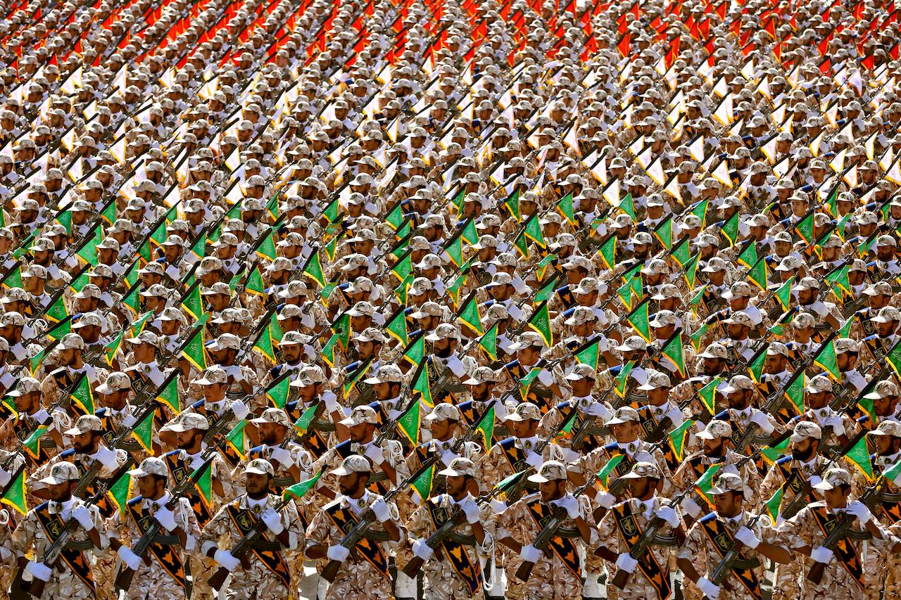 Members of Iran's Revolutionary Guard march during an annual military parade at the mausoleum of Ayatollah Khomeini, outside Tehran, Iran, Sept 22, 2014. Tehran has been accused of arresting foreign nationals on trumped-up charges and using them as hostages in an effort to win concessions from other countries. Photo: AP