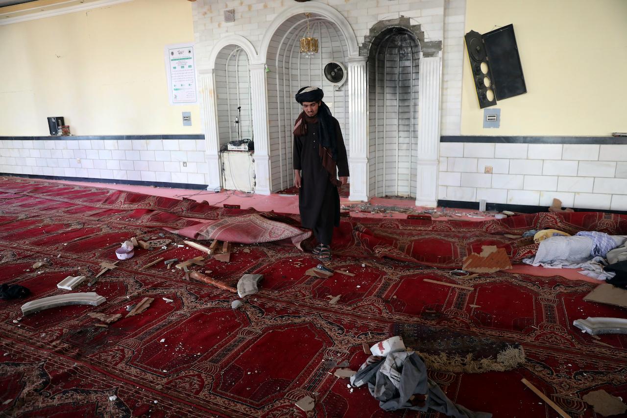 A man inspects the inside of a mosque after a bomb explosion in the Shakar Dara district of Kabul, Afghanistan, May 14. Photo: AP