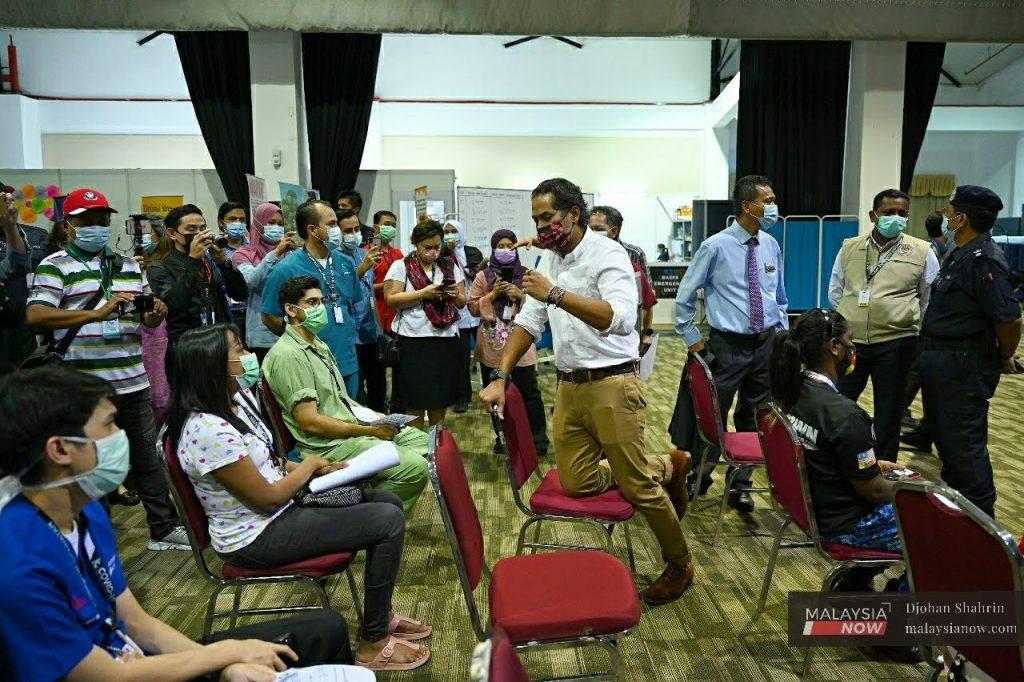 Science, Technology and Innovation Minister Khairy Jamaluddin with frontliners who received their Pfizer jabs in early March at MAEPS Serdang in Seri Kembangan.