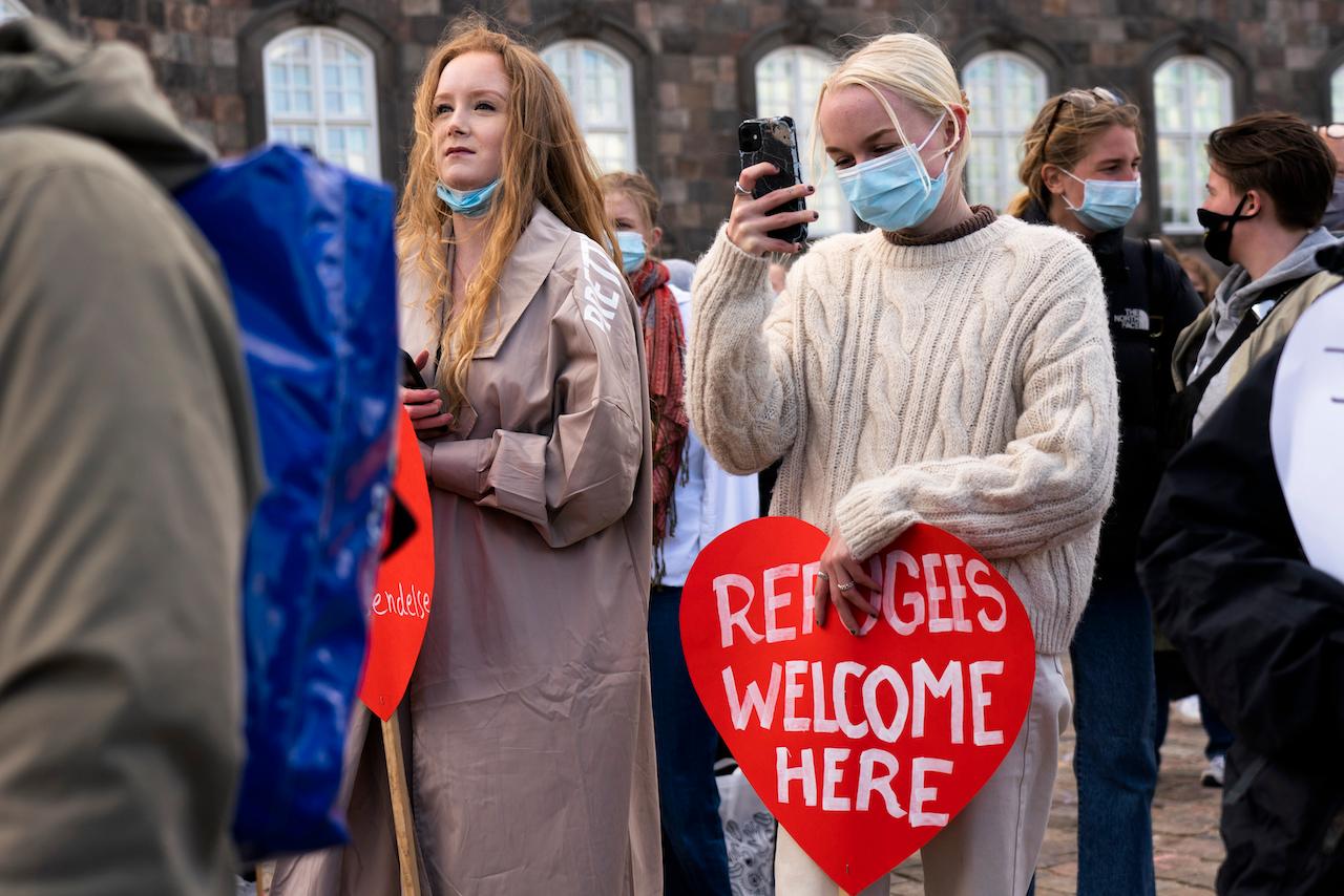 People attend a demonstration against the tightening of Denmark's migration policy and deportation orders in Copenhagen, Denmark, April 21. The government says it has always been clear the protections it offered were temporary. Photo: AP
