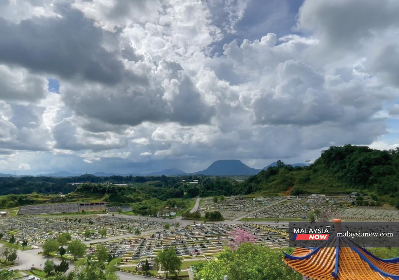 Rows of graves lie under a cloudy sky at Nirvana Memorial Temple in Kuching, Sarawak. The onset of Covid-19 in the country has brought with it many changes to the way death is handled.
