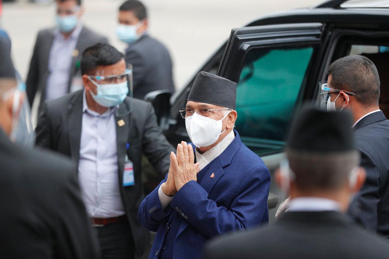Nepal Prime Minister Khadga Prasad Oli (centre) arrives at the parliament in Kathmandu, Nepal, May 10. Photo: AP