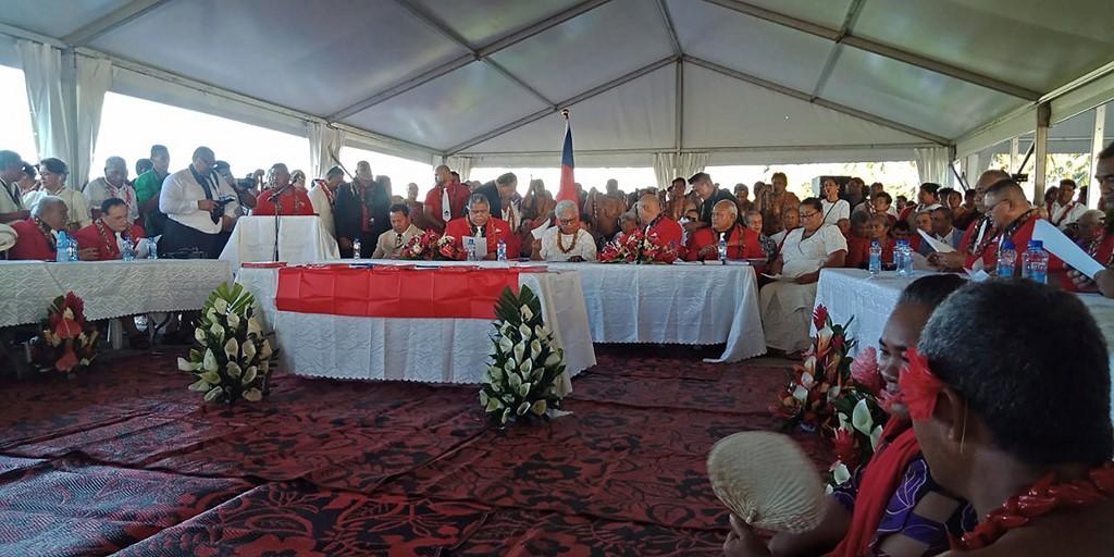 Fiame Naomi Mata'afa (seated, centre) sits with members of parliament and the judiciary as she is sworn in as Samoa's first woman prime minister in Apia on May 24, at an extraordinary makeshift tent ceremony after the island nation's long-ruling government refused to cede power and locked the doors of parliament. Photo: AFP