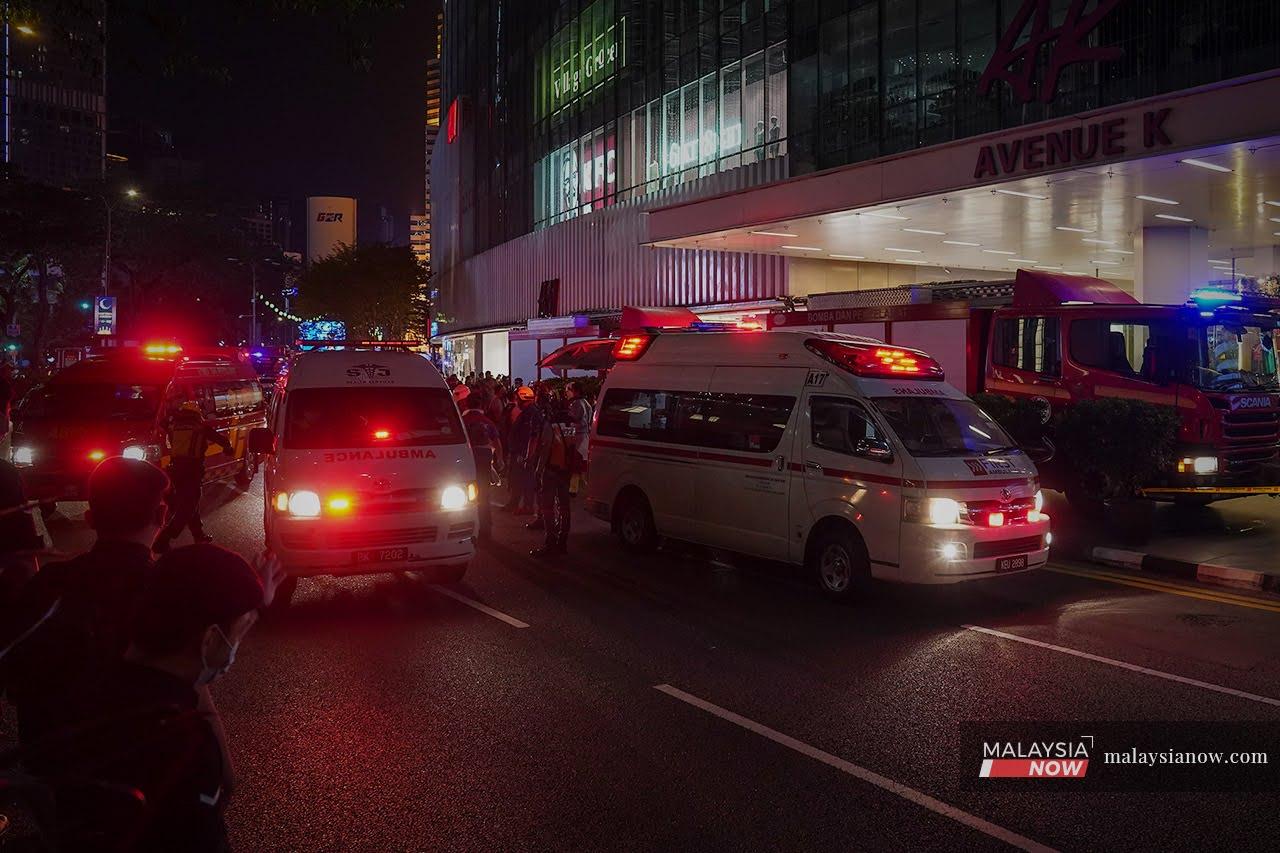 Ambulances wait near Avenue K along Jalan Ampang following a collision between two LRT trains between the KLCC and Kampung Baru stations in Kuala Lumpur last night.