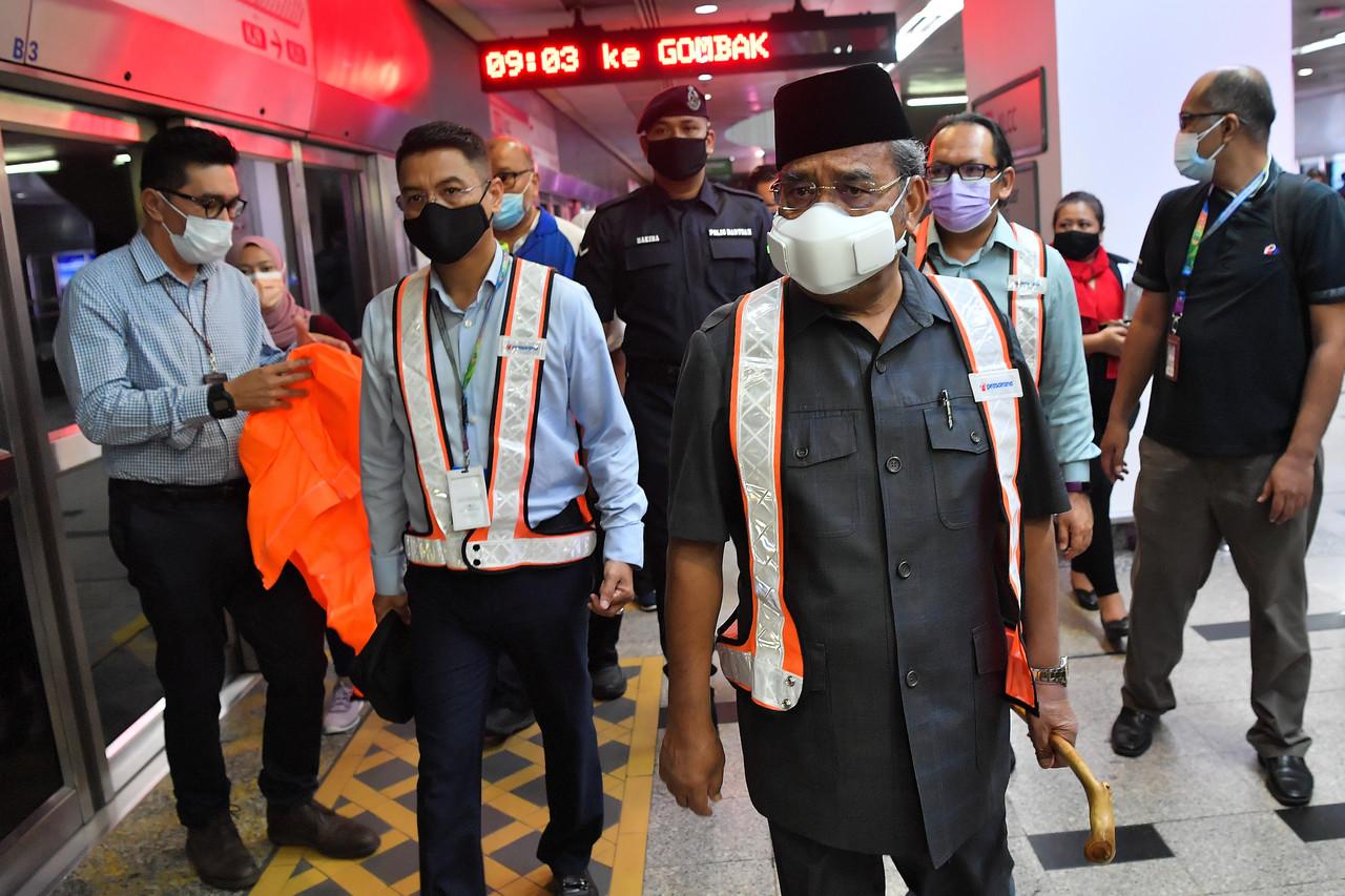 Prasarana Group chairman Tajuddin Abdul Rahman (centre) at the scene of an accident last night between two LRT trains near the KLCC station today. Photo: Bernama