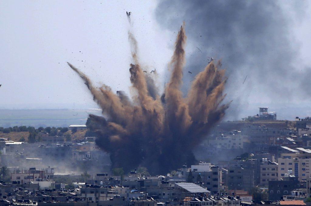Smoke rises following Israeli airstrikes on a building in Gaza City, Thursday, May 13. Photo: AP