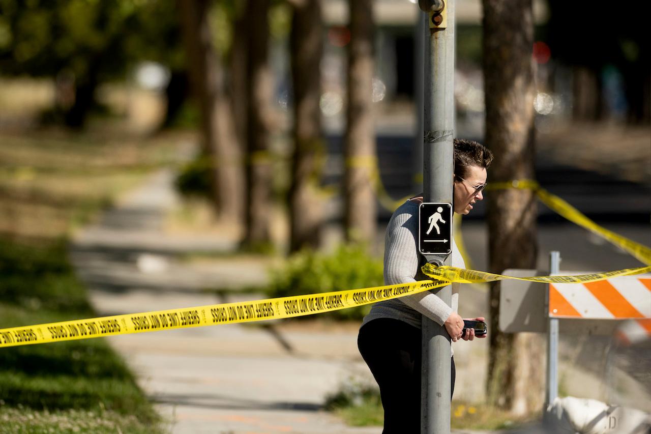 A woman leaves the scene of a shooting at a Santa Clara Valley Transportation Authority facility on, May 26, in San Jose, California. Photo: AP