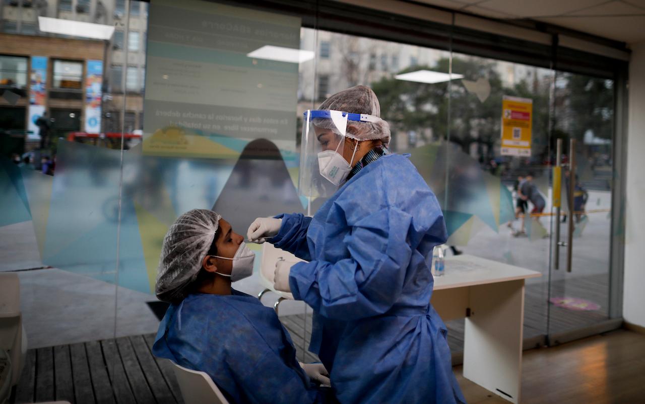 A nurse tests another nurse for Covid-19 in Buenos Aires, Argentina, June 2. Photo: AP