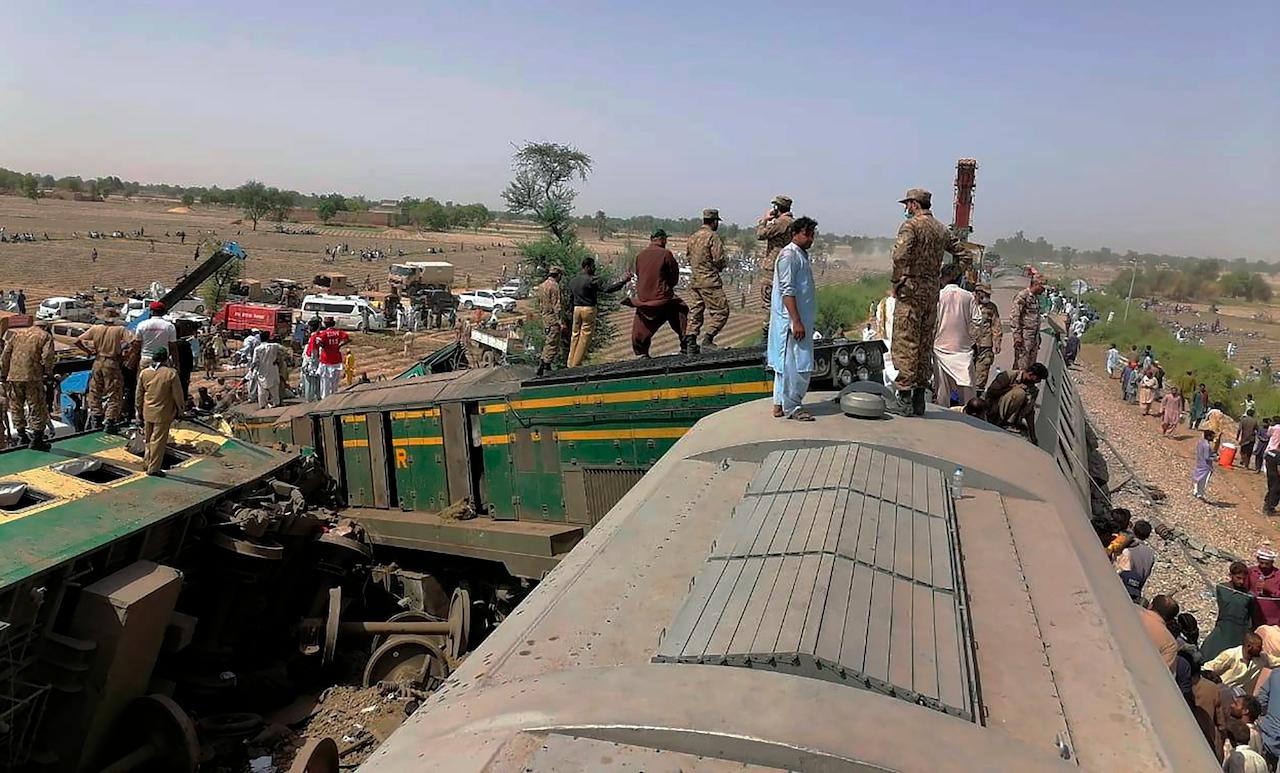Troops and rescuers work at the site of a train collision in Ghotki district in southern Pakistan, June 7. Photo: AP
